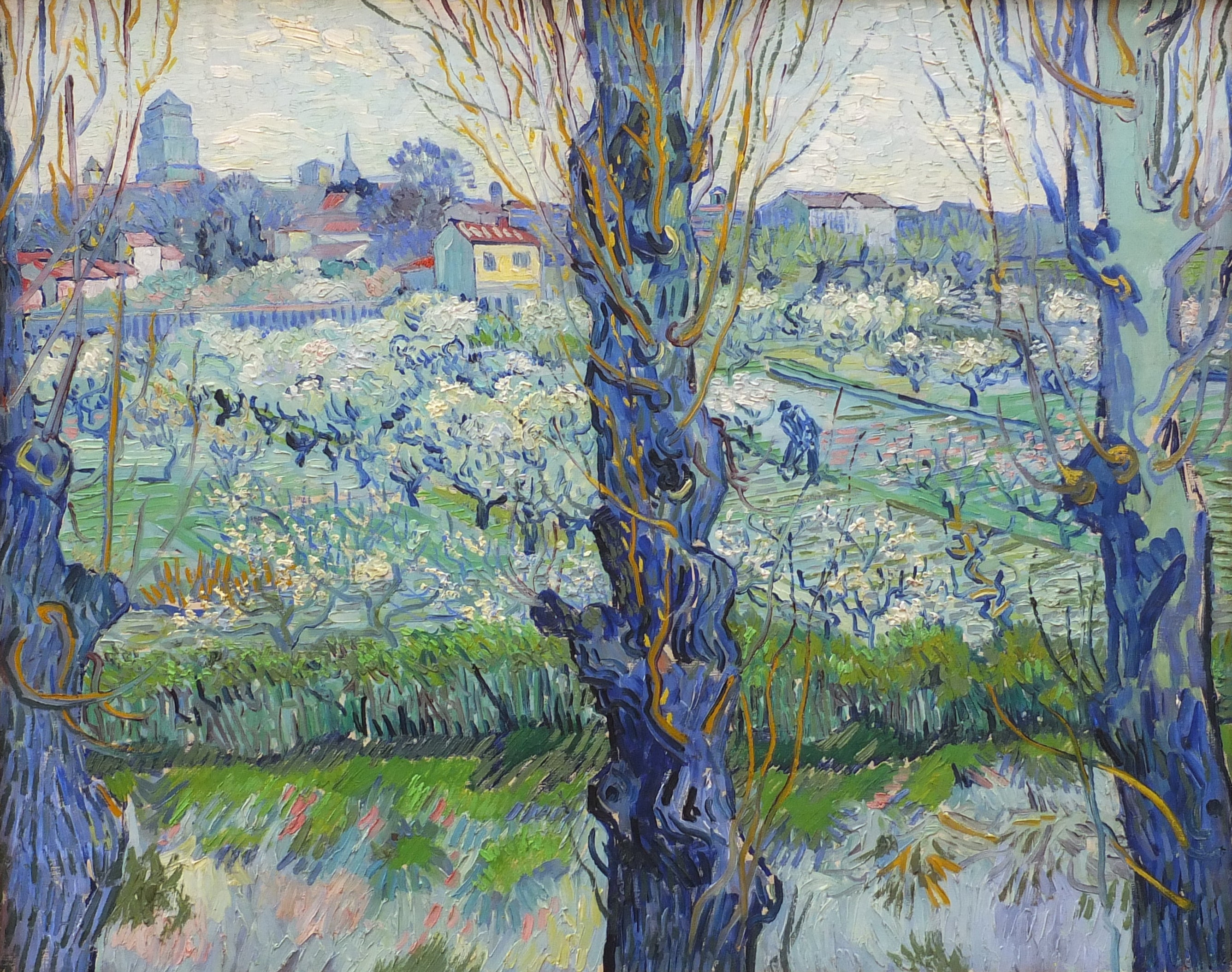 Reproduction du tableau « Verger en fleur avec vue d'Arles - Vincent van Gogh » par Alpha Reproduction en peinture à l’huile
