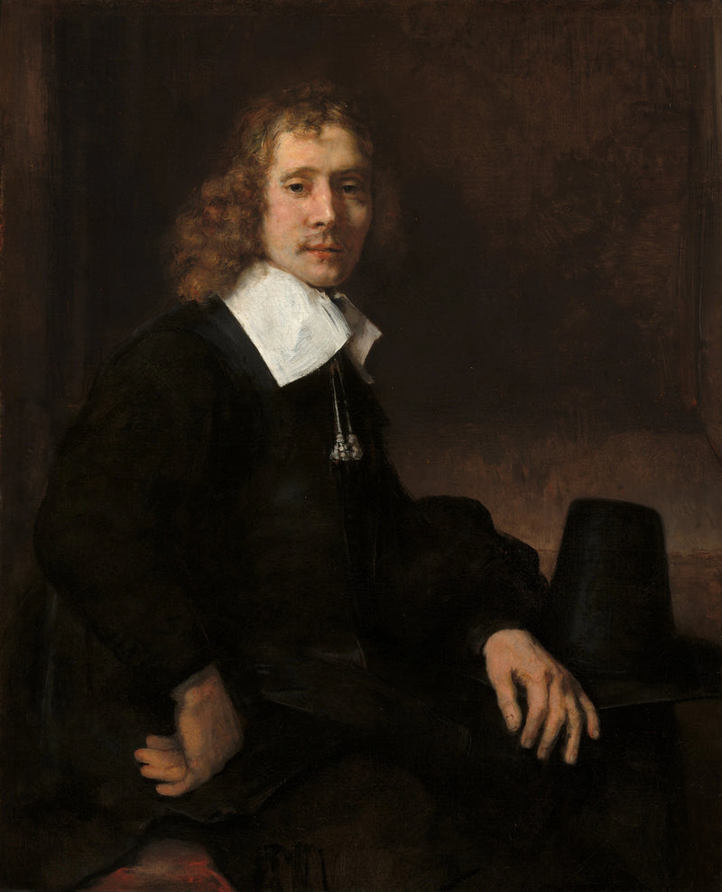 Un giovane uomo seduto a un tavolo (forse Govaert Flinck) - Rembrandt