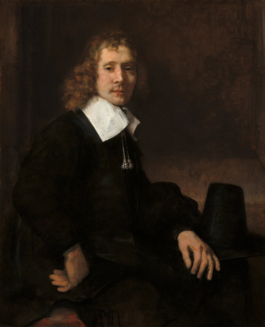 Un giovane uomo seduto a un tavolo (forse Govaert Flinck) - Rembrandt