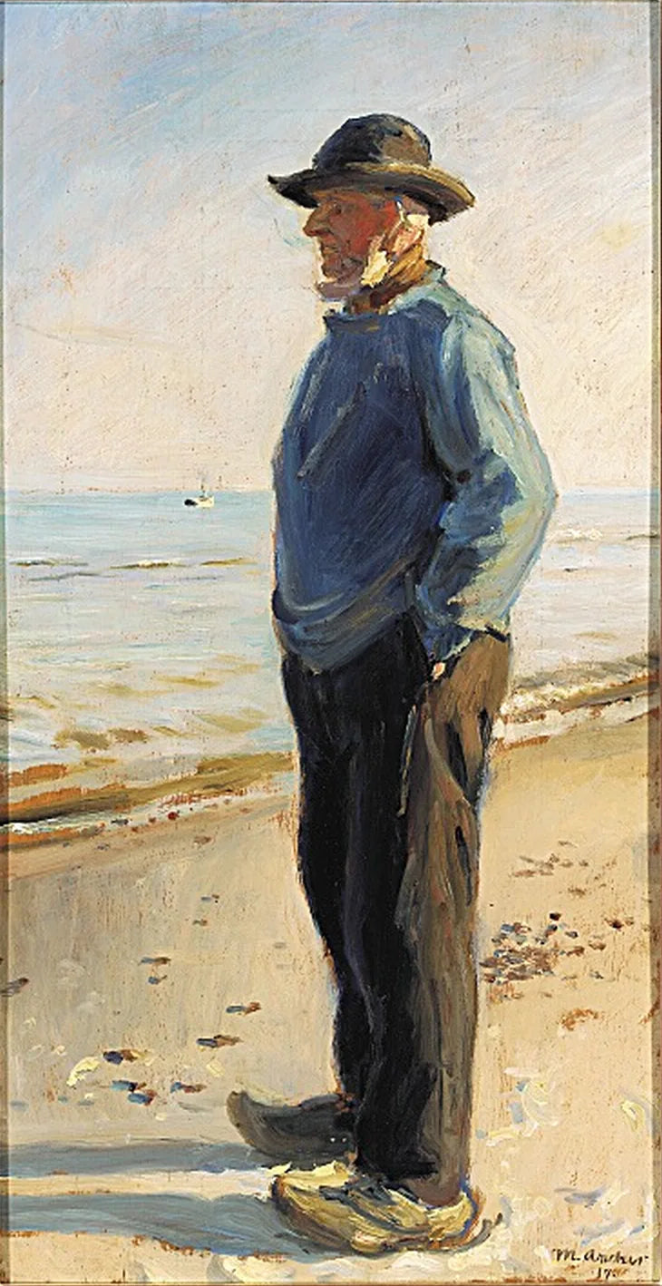 Pescatore di Skagen in piedi sulla spiaggia, con indosso un anorak blu. -Michael Peter Ancher