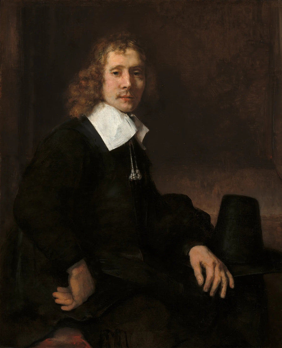 Un giovane uomo seduto a un tavolo (forse Govaert Flinck) - Rembrandt